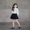 Wiosna Koreański styl nastolatek dziewczyny 2-sztaki zestawy białe koszule + stały kolor plisowany spódnica dzieci ubrania E1362 210610