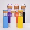 Bottiglie d'acqua magre creative sigillate con coperchi di copertura in bambù Bottiglia riutilizzabile per thermos in vetro siliconico
