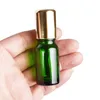 Empty Roll on Bottle 5ml10ml 15ml 20ml 30ml 50ml 100ml Portable Green Glass Cosmetic Packaging Essential Oil Vials Glass Bead Steel Roller With Shiny Gold Cap