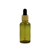 Couvercle en plastique en faux bois Bouteille en verre vert olive Emballage cosmétique Conteneurs rechargeables Flacons compte-gouttes en caoutchouc d'huile essentielle vide 5 ml 10 ml 15 ml 20 ml 30 ml 50 ml 100 ml