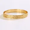 Dites bonjour diamètre intérieur 6789cm de style hawaïen polynésien Gold Couleur Flower Men Femme autour du bracelet Bangle GJZ33263321281