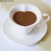 أكواب النمط الأوروبي السيراميك يتوهم كأس القهوة على شكل قلب ومجموعة الصحن النقي الأبيض فاصلة الشاي الأواني الإبداعية