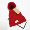 Groothandel hoge kwaliteit winter caps hoeden vrouwen en mannen mutsen met echte wasbeer bont pompoms warme meisje cap snapback pompon muts 517