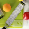 Schokoladen-Zitrone-Käse-Reibe-Mehrzweck-Werkzeug Edelstahl scharfer Gemüse-Fruchtkäse-Ingwer-Knoblauch-Späne-Hobel-Küchenzubehör JY1009