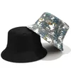 Cloches Uomo Donna Cappello estivo reversibile a secchiello Cappello tropicale con foglie di palma Stampa Hip Hop Protezione solare a tesa larga Cappello rotondo piatto da pescatore