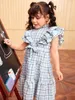 幼児の女の子の格子縞のプリントフリルの裾ベルトのモックネックドレス