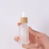 Bouteilles d'emballage 5ml-100ml compte-gouttes en verre dépoli flacon rechargeable vide pour cosmétique avec capuchon en bambou imité