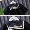Le ragazze dei bambini della primavera vestono i vestiti di modo dei bambini della principessa del collare del marinaio delle maniche a sbuffo della maglia nera E1137 210610