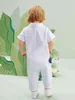 Baby dinosaur brief grafische polo nek jumpsuit zij