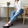 Sitio web oficial de la marca Pantalones de mujer Lápiz 2021 Primavera y verano Bordado Agujero Casual Nueve puntos