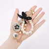 Imitation Pearl Perfume Crystal Bottle Iron Tower Chain Keychain Car Key Ring Bag Charm Accessories Bow Women Girl Keyring Gift G1019