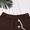 Simple Strokes Avatar Jacquard Stickad kjol Kvinnor Casual Button High Wasit Hip Kvinna Sweet 210520