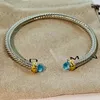 Bangle Cable Classic Collection Bracelet With Blue Topaz And Black Onyx 18K Yellow Gold265C