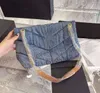 Fabriksförsäljning LouLou Puffers Denim Jeans Axelremsväskor Toppkvalitet Frosted Kohudsrem för kvinnor Heavy Chain Crossbody Bag 2021