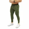 Męskie spodnie 2022 Est Mens Casual Fitness Workout Slim Fit Dressuit Skinny Spodnie Dysfunda Pocić z bezpieczną kieszenią na suwak