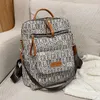 wholesale Bolsos de hombro de cuero para mujer Mochilas con estampado de Harajuku ligeros y cómodos bolso de cuero de contraste street trend mochila de mujer de gran capacidad