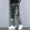 Pantalones vaqueros para hombre Yoa otoño nuevos pantalones vaqueros con estampado de letras marca de moda para hombre leggings con graffiti de dibujos animados sueltos y pantalones con cordón 022023H