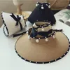 Sombrero de paja de playa de moda para mujer, gorras de protección solar plegables de verano, gorra de vendaje de perlas, gorra de Color sólido, sombreros de visera informales para vacaciones