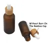 Botella cuentagotas de vidrio blanco ámbar esmerilado 15ml 30ml 50ml con tapa de bambú Botellas de aceite esencial de madera de 1 oz