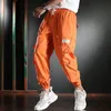 Pantalones pantanos holgados naranja hombres de carga de verano ropa de hip hop de algodón de algodón pantalones con cordón