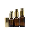 Lozione spray d'oro Pompa per pressa Emulsione Bottiglia riutilizzabile Profumo di vetro marrone vuoto Fiale per contenitori di imballaggio cosmetico 5ml 10ml 20ml 30ml 50ml 100ml