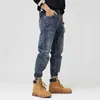 Jeans da uomo alla moda in stile coreano retrò blu larghi pantaloni casual in denim hip-hop da strada strappati a gamba larga