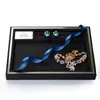 Punteggi di gioielli di alta qualità oggetti di gioielli in velluto nero piatto che mostra scatole di stoccaggio del supporto per gioielli vassoio