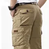Mäns Overaller Militär Army Cargo Pants Spring Cotton Baggy Denim Byxor Man Multi-Fickor Casual Long Trousers Plus Storlek 42 210707