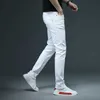 SHAN BAO hommes ajusté Slim blanc jean printemps classique marque haute qualité confortable coton Stretch mode pantalons décontractés 210723