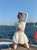 Womengaga T Gömlek kadın Yaz Tops Tees Seksi Kız Bandaj Backless Plaj Beyaz Uzun Kollu Üst + Katlama Mini Etek AMA3 210603