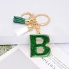 Moda Sprzedaż Kobiet Letter Breloki 26 Glitter Hollowed-out Angielski Alfabet Key Pierścień Torebka Rzemiosło Biżuteria Charms Prezent