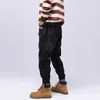 Straße stil mode männer jeans schwarz elastisch lose fit zerrissenen spleißte gemalt designer hip hop spritzte denim hosen