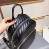 Diseñador- Mochila de moda bolso de hombro patrón de cuero negro 26 cm bolso de viaje de alta calidad carteras de compras