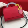 New Arrivals high quality Twist mid-size handbag Shoulder Bags Glass handle and colorful brand pendant Removable leather strap size23*17*9.5cm