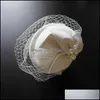 white fascinator with veil