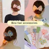 Deft Bun Hair Band DIY Donut Maker Ragazze Donne Stampa annodato Twister flessibile Strumento per lo styling Fascia Bigodino Accessori per capelli