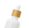 15 ml 20 ml 30 ml 50 ml beyaz porselen uçucu yağ şişesi ahşap tahıl kapağı damlalık parfüm şişeleme
