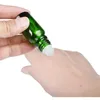 Rouleau vide sur bouteille 5 ml 10 ml 15 ml 20 ml 30 ml 50 ml 100 ml Emballage cosmétique en verre vert portable Flacons d'huile essentielle Rouleau en acier avec billes de verre avec capuchon doré brillant