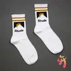 Chaussettes de rhude lettre simple de haute qualité coton européen américain de rue des chaussettes de tendance de rue hommes et femmes chaussettes à aiguille chaleureuse et confortable couple couple intube so s4cq