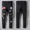 Amirs Herrkvinnor Designers Jeans nödställda rippade cyklist Slim Straight denim för män tryck armé mode mans mager byxor268e