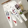 Women White Skinny Denim Pants Cartoon Graffiti Printed Stretch Jeans Autumn Slim Body Pencil Ladies Plus Size 211129