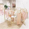 Clothing store double row middle island racks Commercial Furniture floor type window display rack children's clothes stores gold coat hanger