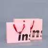 Återvunnen bärare Handväska Custom Logo Tryckt påsar Matt Finish Pink Paper Shopping Bag med Grosgrain Ribbon Handle