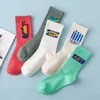 Hommes et femmes mode coton lettre chaussettes Couples originaux unisexe Hiphop drôle Streetwear sport respirant Skateboard Sox à la mode