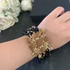 2021 Trend Top Kvalitet Berömda Märke Party Mode Smycken Armband För Kvinnor Europa Lyx Cross Vintage Star Bangles