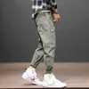 Koreański styl moda przypadkowi męskie dżinsy luźne dopasowanie duże kieszonkowe spodnie ładunkowe jasnozielone bramka streetwear hip hop szeroki nogi harem spodnie