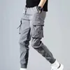 Harem Calças Homens Nova Moda Moda Preto Draorstring Cintura Solta Calças Casuais Botões Botões de Sweatpants Hip-Hop Calças Masculino 2020 Novo X0723