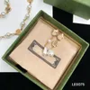 Damdesigners Klassiker Halsband Pärlor Armband i rostfritt stål Kvinnor Bokstavsblomma Enkel Lyxörhängen Elegant med låda