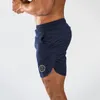 Muscleguys Hommes Slim Fit Pantalons courts Fitness Bodybuilding Joggers Hommes Shorts Pantalons de survêtement Fitness Workout Dry Quick Shorts 210421