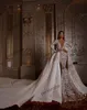 Tiefes V-Ausschnitt Meerjungfrau-Hochzeitskleid mit abnehmbarer Zug Sheer Langarm-Spitzen-Applique-Brautkleider sehen durch Robe de Soirée
